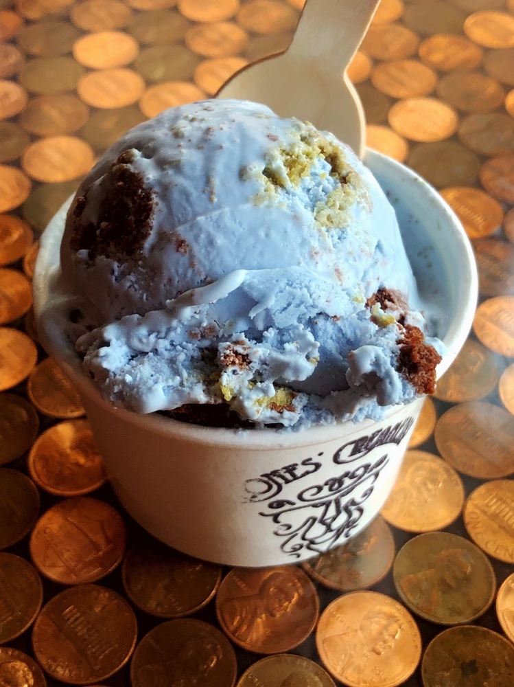 Our vanilla ice cream that we dye blue with butterfly pea flower powder! We toss in pieces of housemade chocolate and matcha cakes, so each scoop looks like a little planet Earth!