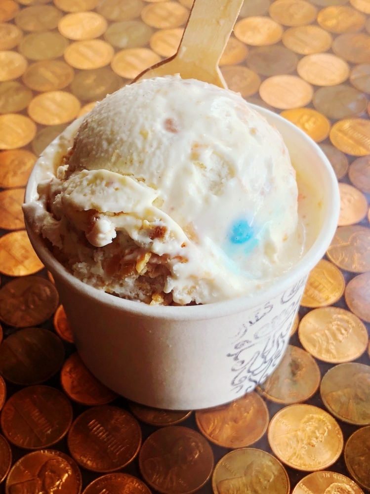 Cinnamon-vanilla ice cream with a peanut butter ribbon, and full of monster cookie bits!